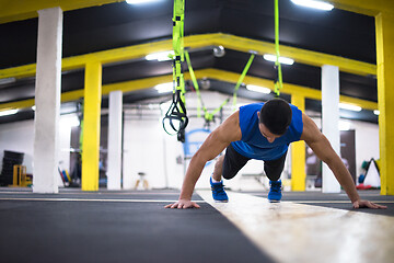 Image showing Young  man doing pushups