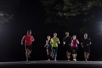 Image showing runners team on the night training