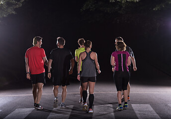 Image showing runners team on the night training