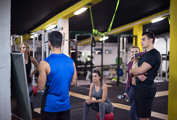 Image showing athletes getting instructions from trainer