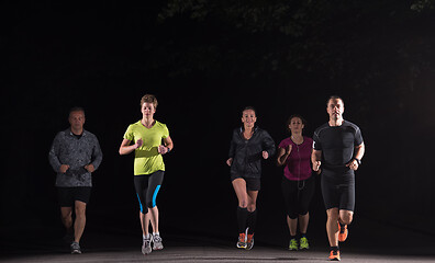 Image showing runners team on the night training