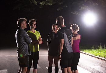 Image showing runners team on the night training