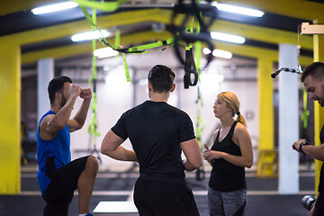 Image showing athletes working out  jumping on fit box