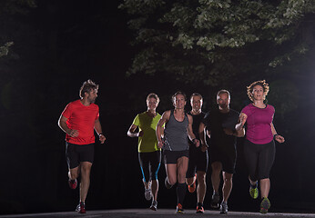 Image showing runners team on the night training