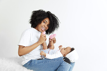 Image showing Portrait of beautiful african woman holding on hands her little baby