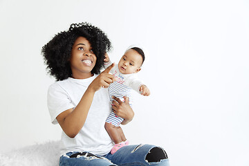 Image showing Portrait of beautiful african woman holding on hands her little baby