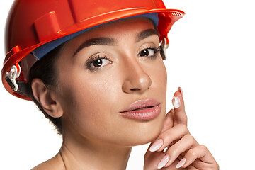 Image showing Portrait of confident female worker in orange helmet