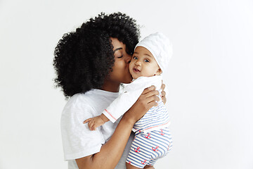 Image showing Portrait of beautiful african woman holding on hands her little baby