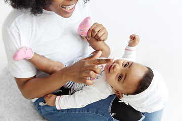 Image showing Portrait of beautiful african woman holding on hands her little baby