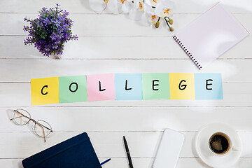 Image showing Stationery and word COLLEGE made of letters on wooden background