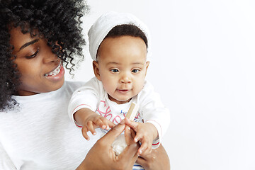 Image showing Portrait of beautiful african woman holding on hands her little baby