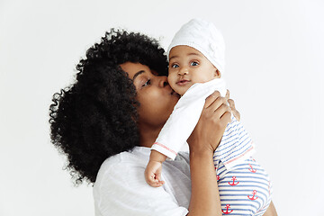 Image showing Portrait of beautiful african woman holding on hands her little baby