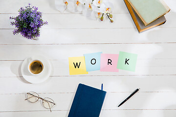 Image showing WORK. Message at colorful note papers on a desk background.