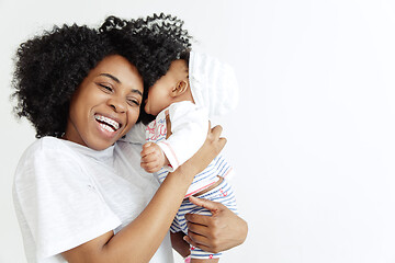 Image showing Portrait of beautiful african woman holding on hands her little baby