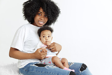 Image showing Portrait of beautiful african woman holding on hands her little baby