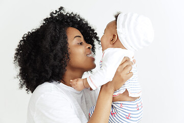 Image showing Portrait of beautiful african woman holding on hands her little baby