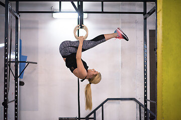 Image showing woman working out on gymnastic rings