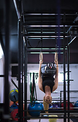 Image showing woman working out on gymnastic rings