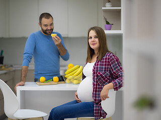 Image showing couple cooking food fruit lemon juice at kitchen