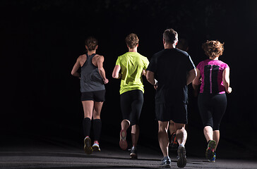 Image showing runners team on the night training