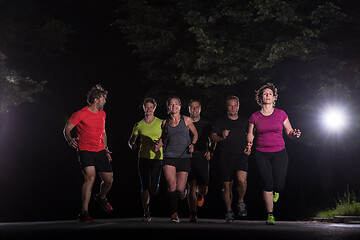 Image showing runners team on the night training