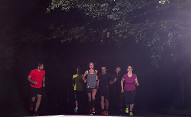 Image showing runners team on the night training