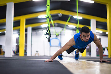 Image showing Young  man doing pushups