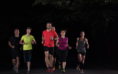 Image showing runners team on the night training