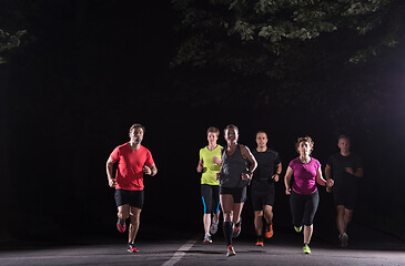 Image showing runners team on the night training