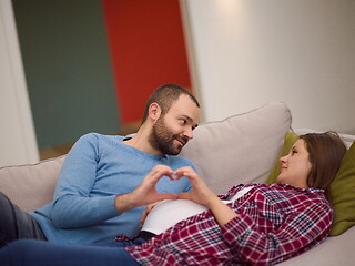 Image showing man and pregnant woman showing heart sign