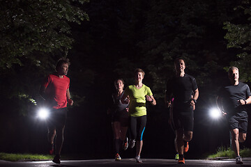 Image showing runners team on the night training