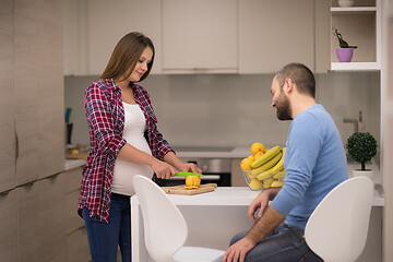 Image showing couple cooking food fruit lemon juice at kitchen