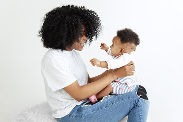 Image showing Portrait of beautiful african woman holding on hands her little baby