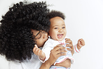 Image showing Portrait of beautiful african woman holding on hands her little baby