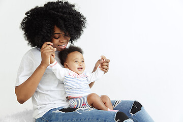 Image showing Portrait of beautiful african woman holding on hands her little baby