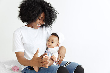 Image showing Portrait of beautiful african woman holding on hands her little baby