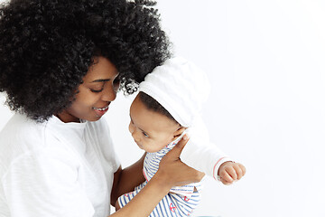 Image showing Portrait of beautiful african woman holding on hands her little baby