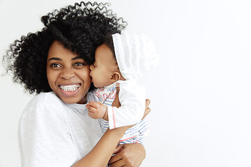 Image showing Portrait of beautiful african woman holding on hands her little baby