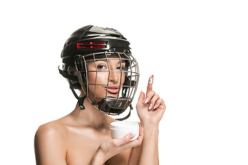 Image showing Female hockey player in helmet and mask