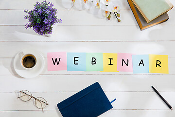 Image showing WEBINAR. Message at colorful note papers on a desk background