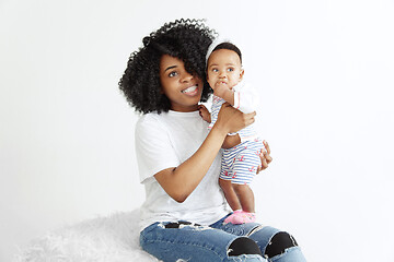 Image showing Portrait of beautiful african woman holding on hands her little baby