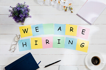 Image showing WE ARE HIRING. Message at colorful note papers on a desk