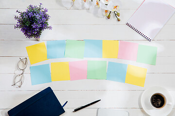 Image showing Message at colorful note papers on a desk background.