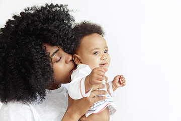 Image showing Portrait of beautiful african woman holding on hands her little baby