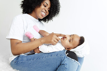 Image showing Portrait of beautiful african woman holding on hands her little baby