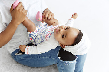 Image showing Portrait of beautiful african woman holding on hands her little baby