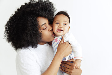 Image showing Portrait of beautiful african woman holding on hands her little baby