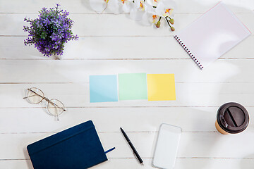 Image showing Message at colorful note papers on a desk background.