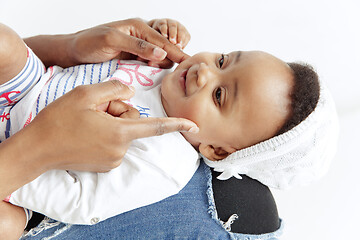 Image showing Portrait of beautiful african woman holding on hands her little baby