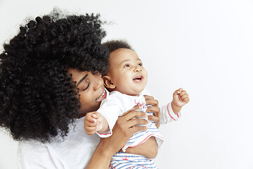 Image showing Portrait of beautiful african woman holding on hands her little baby